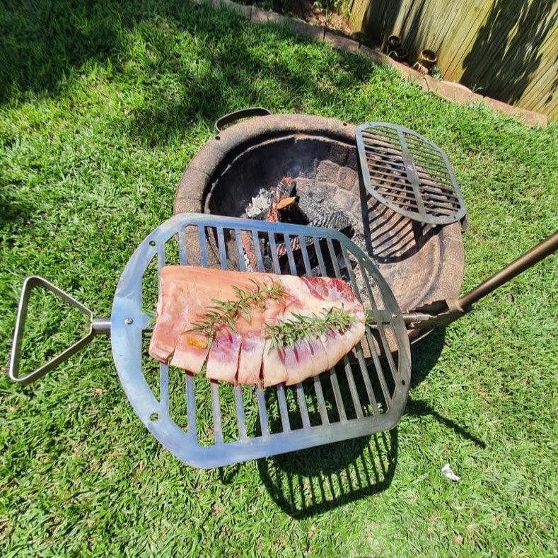 Fire cooking outlet grate